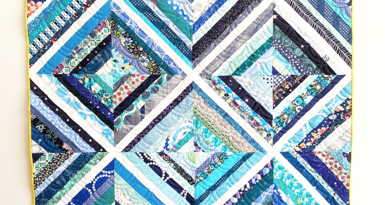 Biased (the scrappy rainbow strip quilt)